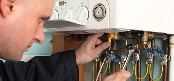 boiler-being-serviced-with-spanner
